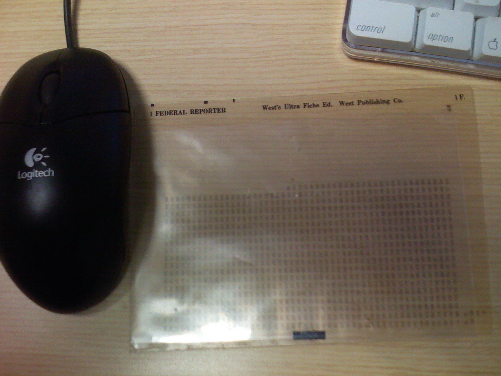 Westlaw ultrafiche, shown next to a computer mouse